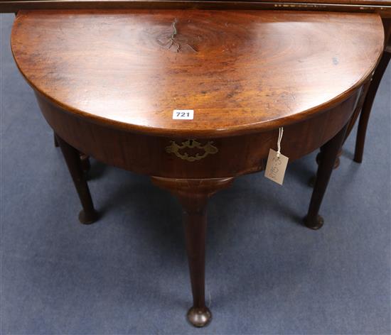 A mid 18th century mahogany demi lune table, W.77cm